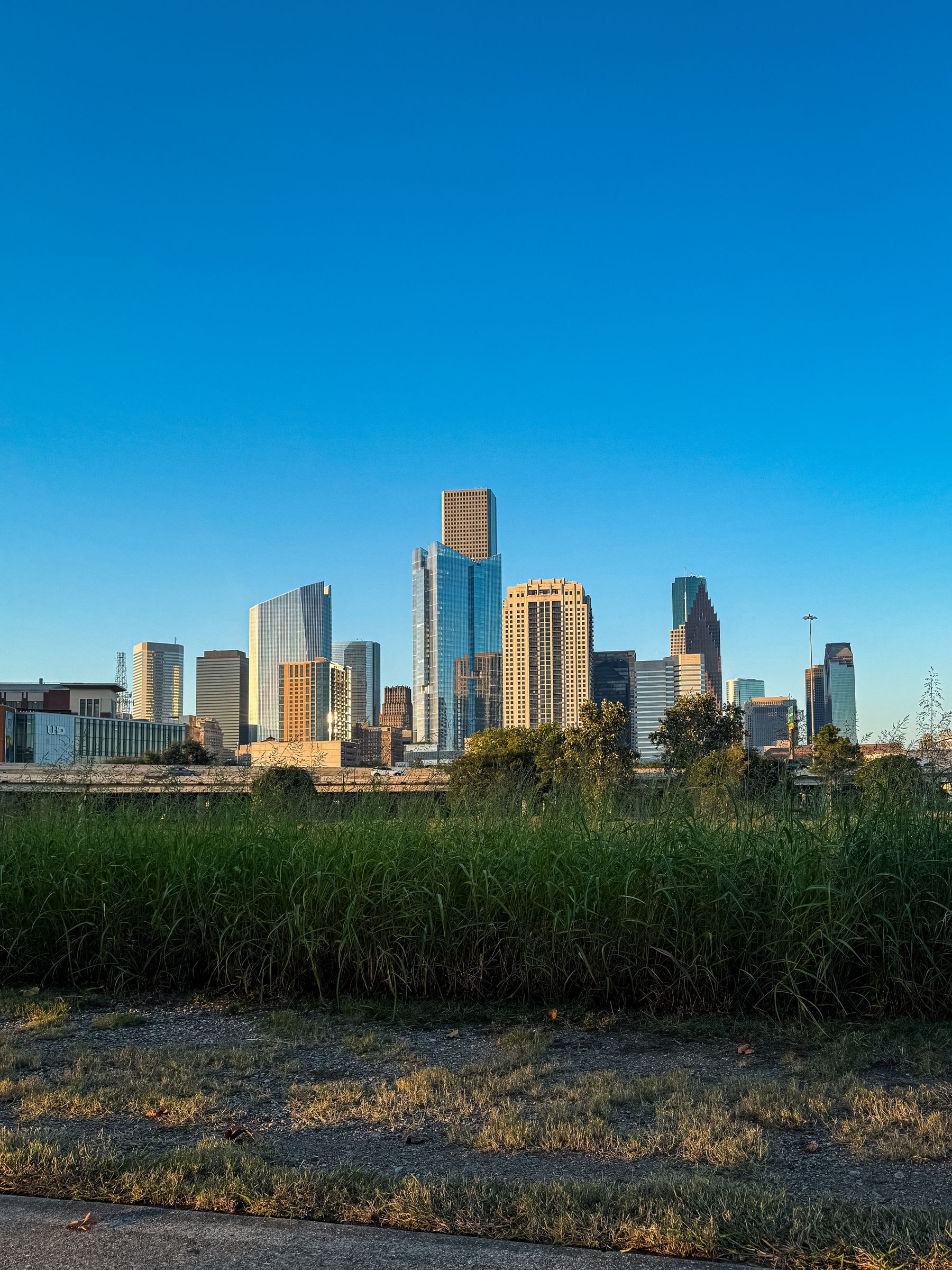 Houston skyline beneath a clear blue Texas sky